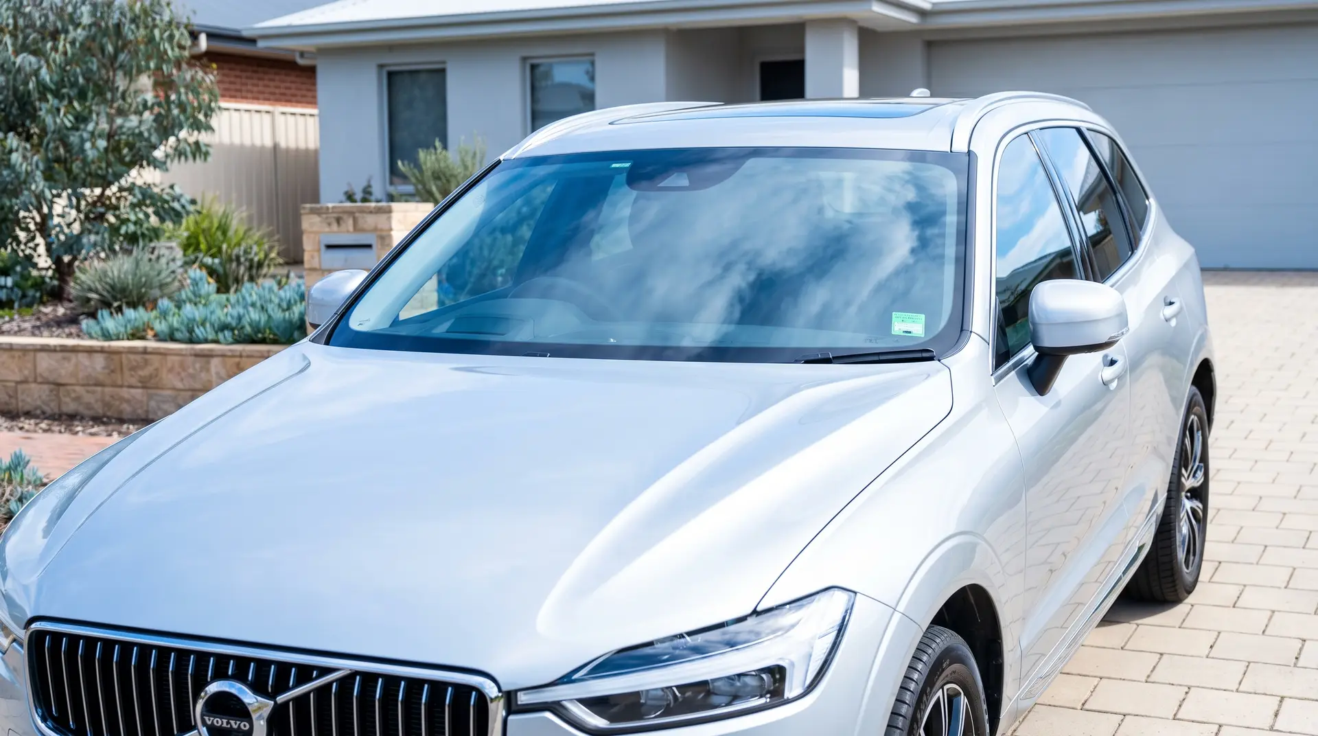 Clean modern car with a new windscreen in an Adelaide driveway